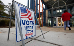 NORCROSS, GEORGIA - NOVEMBER 5: A voter enter the polling station at Lucky Shoals Park Recreation Center on November 5, 2024 in Norcross, Georgia. Americans cast their ballots today in the presidential race between Republican nominee former President Donald Trump and Democratic nominee Vice President Kamala Harris, as well as multiple state elections that will determine the balance of power in Congress.   Jessica McGowan/Getty Images/AFP (Photo by Jessica McGowan / GETTY IMAGES NORTH AMERICA / Getty Images via AFP)