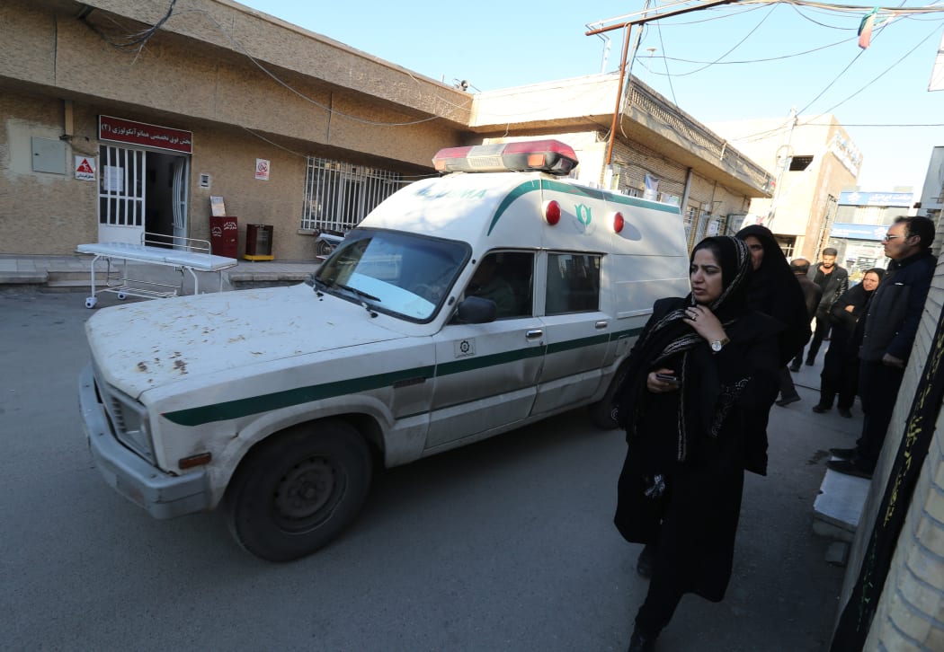 People arrive at a hospital in the southeastern Iranian city of Kerman to look for their loved ones following a stampede that broke out at funeral of Iran's top military general Qasem Soleimani.