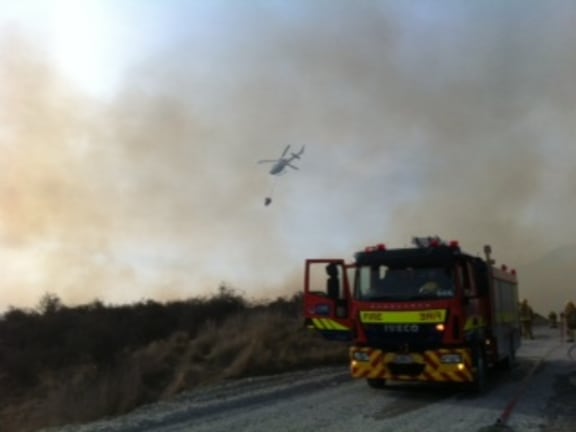 Three crews are battling an out of control blaze in the Remarkables