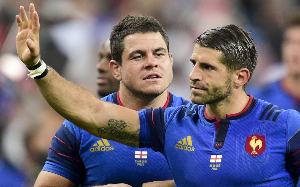France's Guilhem Guirado and Sebastien Tillous Borde wave to the crowd.