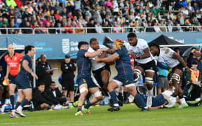 Flying Fijians captain Tevita Ikanivere take on the Spanish in their test. Fiji won.