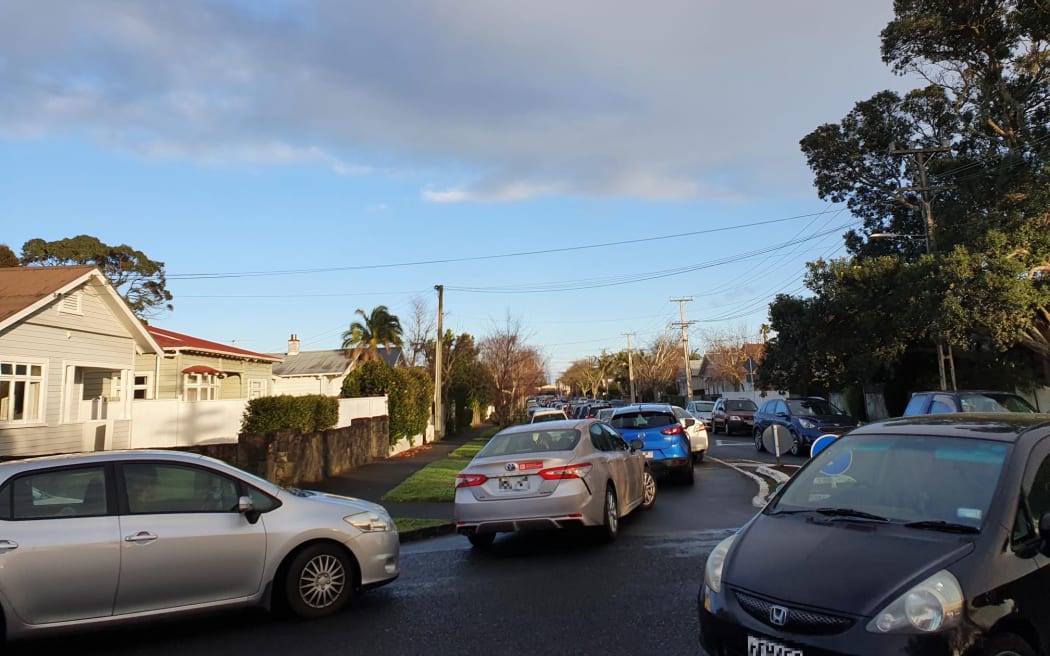 Traffic down Rocklands Rd, a side street leading to the Northcote community testing centre. 19 August 2021