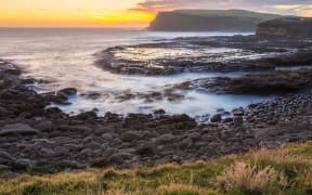 Golden sunset at Curio Bay, the Catlins, New Zealand