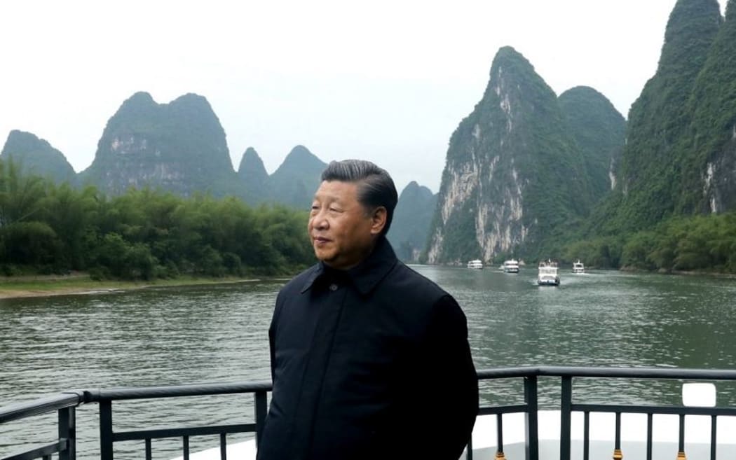 (220106) -- BEIJING, Jan. 6, 2022 (Xinhua) -- Chinese President Xi Jinping, also general secretary of the Communist Party of China Central Committee and chairman of the Central Military Commission, visits a section of the Lijiang River in Yangshuo,