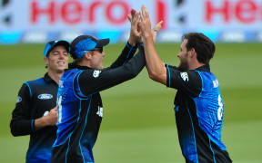 Mitchell Santner , Martin Guptill and Mitchell McClenaghan of the Black Caps celebrates a wicket during the Second Cricket ODI, Black Caps V Sri Lanka.
