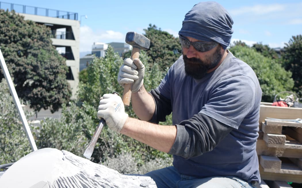 Italian artist Fransesco Panceri at work during the Stone Sculpture Symposium in New Plymouth.
