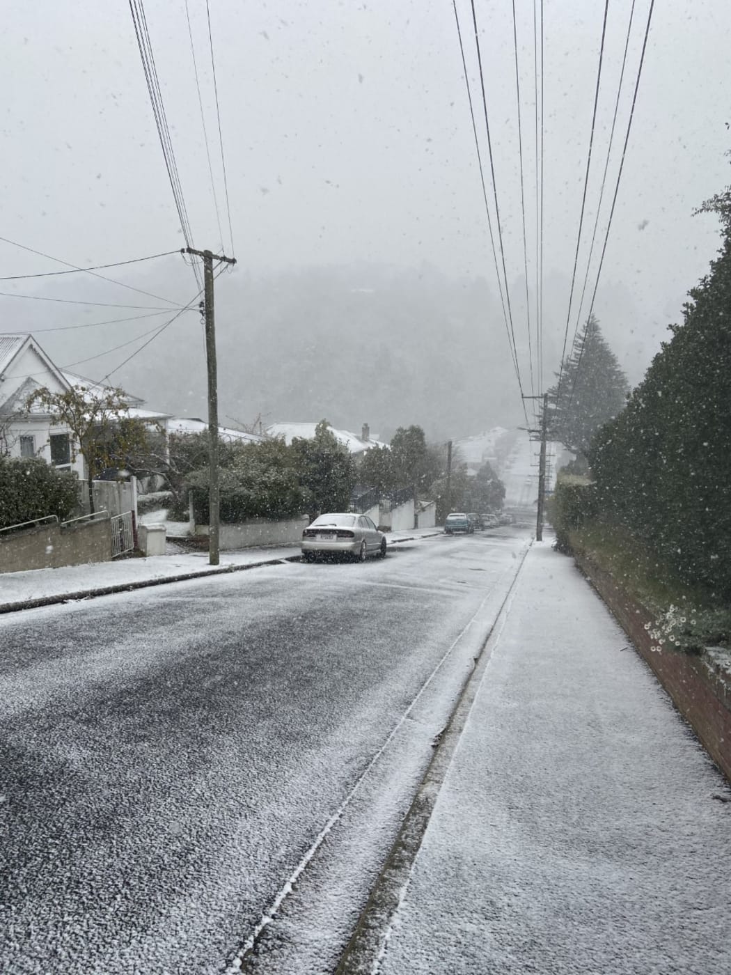 Snow on a hilly street in Dunedin,