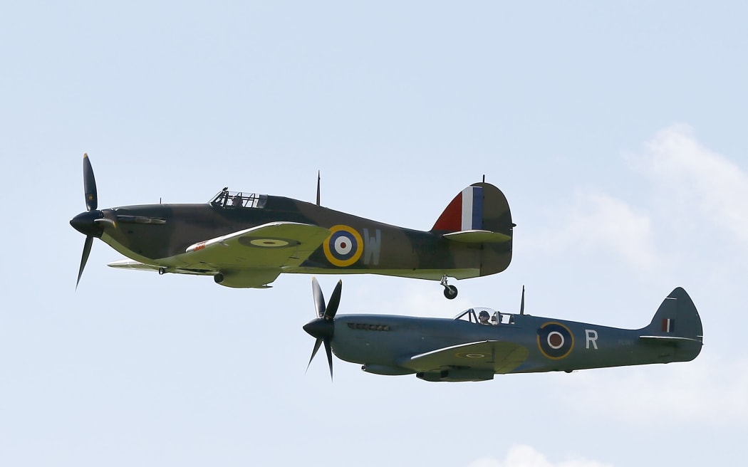 Battle of Britain aircraft fly during a display at Goodwood Aerodrome in West Sussex.