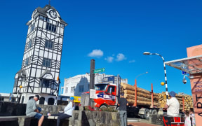 People gather to watch the Stratford glockenspiel perform Romeo and Juliet.