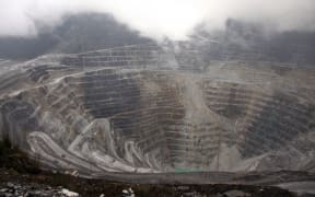 Tthis photograph taken on August 16, 2013 shows a general view of the Freeport McMoRan's Grasberg mining complex, one of the world's biggest gold and copper mines located in Indonesia's remote eastern Papua province.
