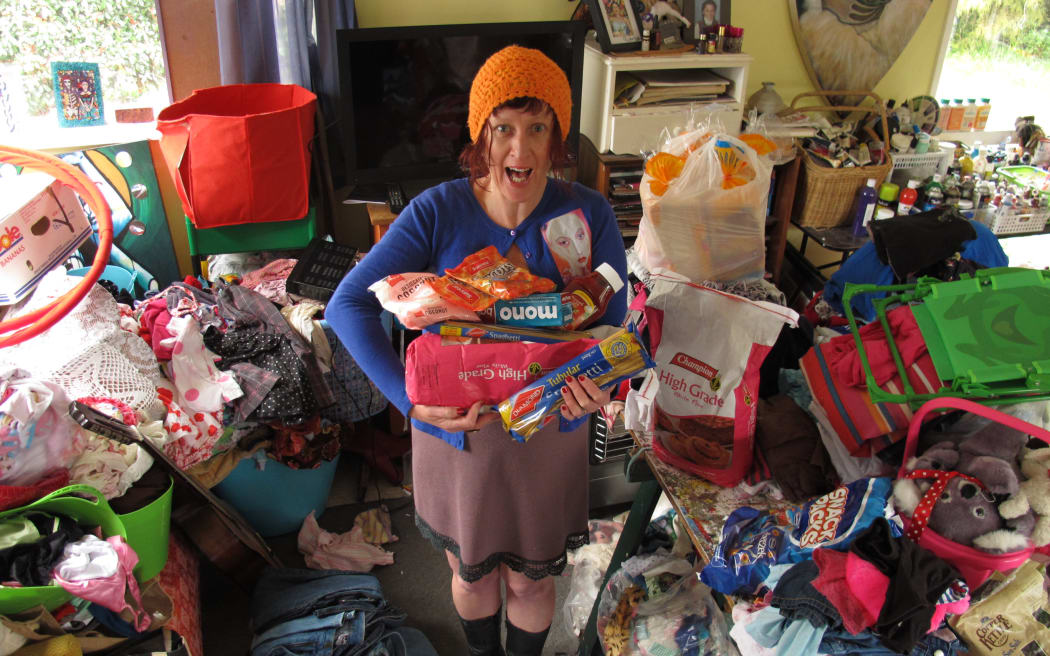 Monika Welch surrounded by donated food and clothing in 2013, when she first set up the charity Finkk (‘Families in Need Kerikeri’).