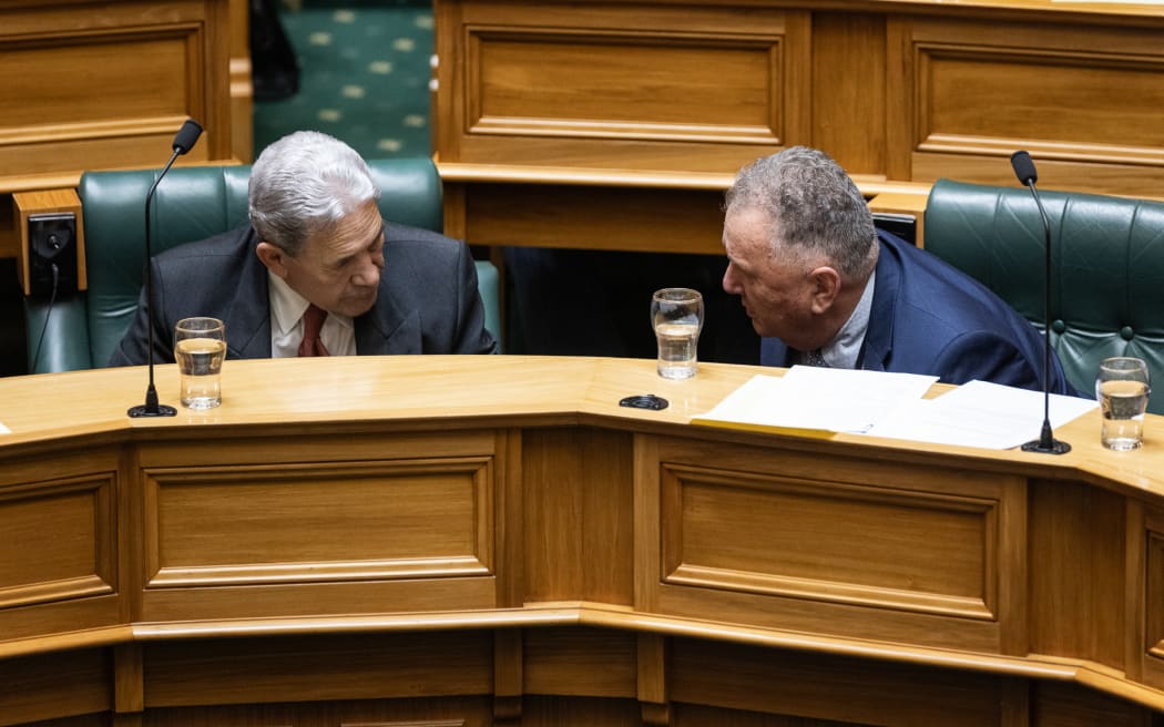 The New Zealand First Party leadership consult during Question Time.