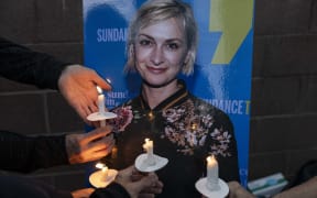 Locals and members of the local film community mourn the loss of cinematographer Halyna Hutchins, who died after being shot by Alec Baldwin on the set of his movie Rust at a vigil in Albuquerque, New Mexico, US.