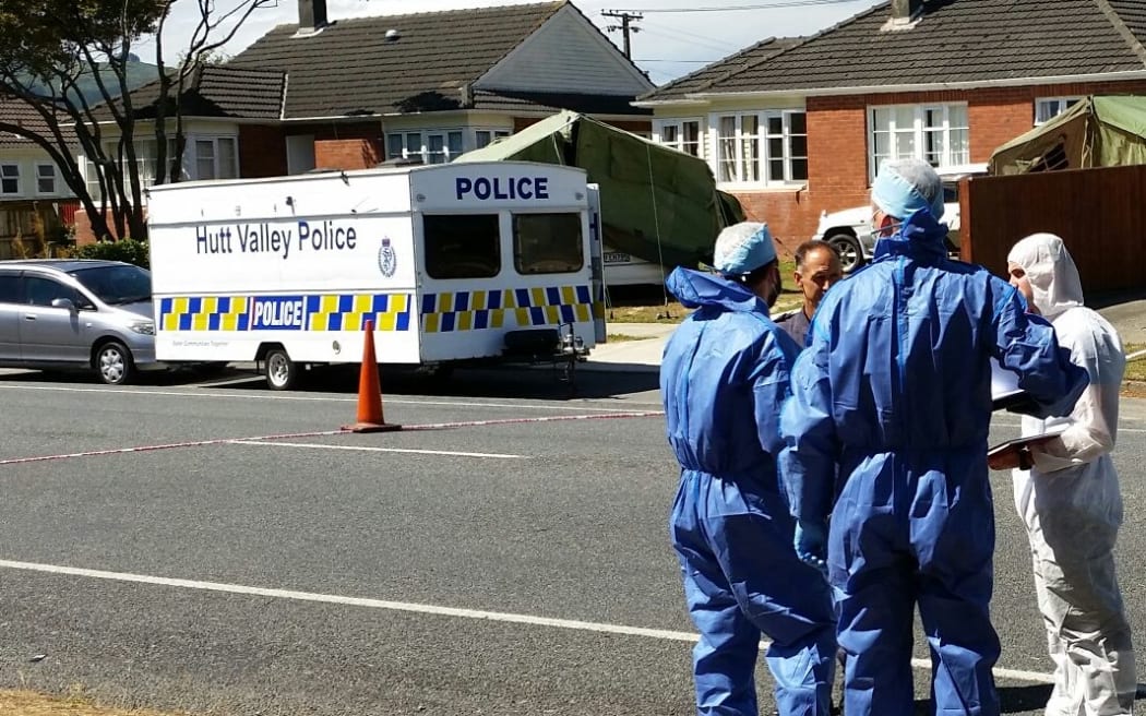 Police and forensic investigators at the scene in Taita on Friday.