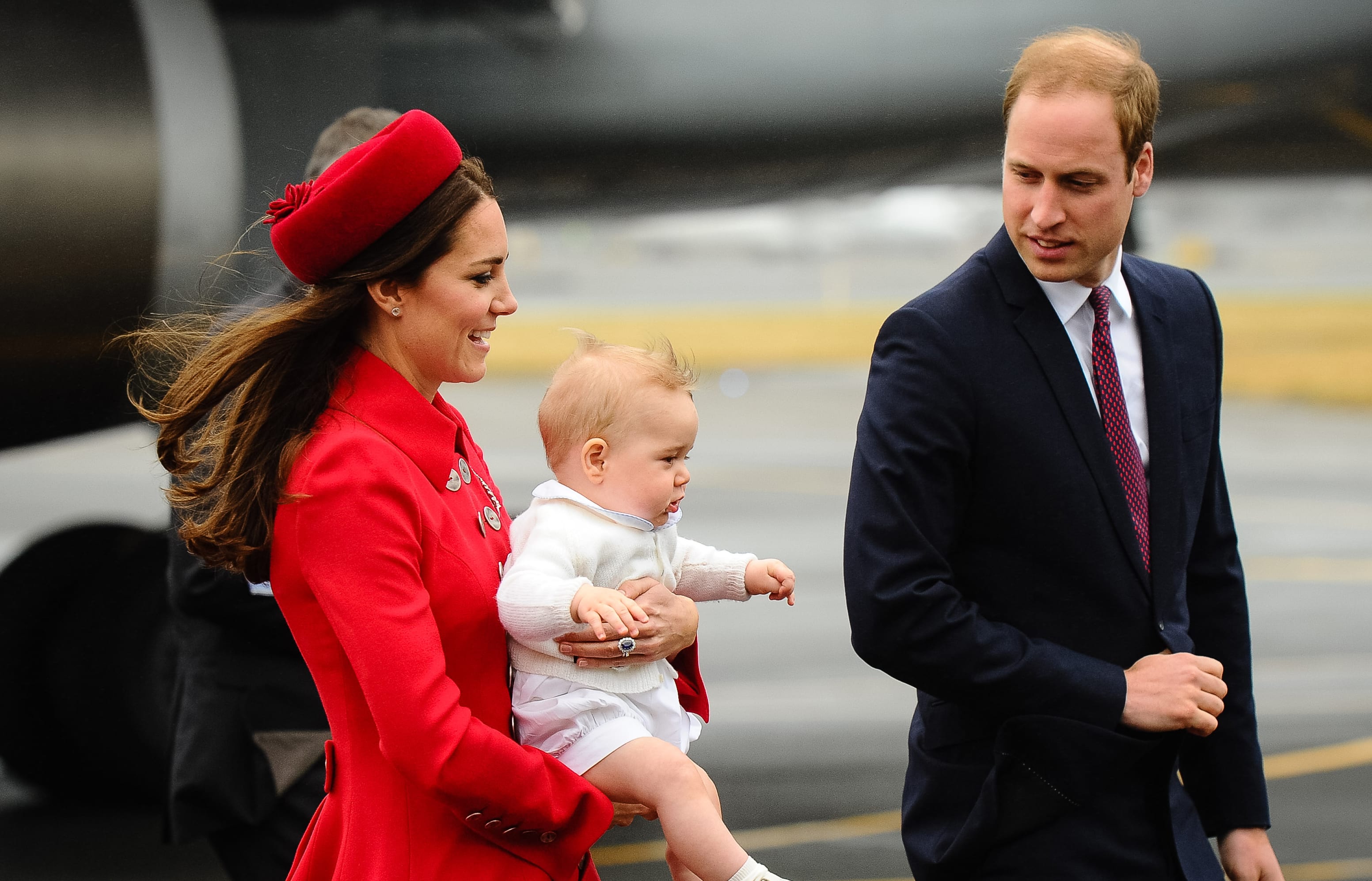 Prince William and Duchess of Cambridge, Catherine, carrying Prince George upon their arrival at the international airport in Wellington on April 7, 2014.