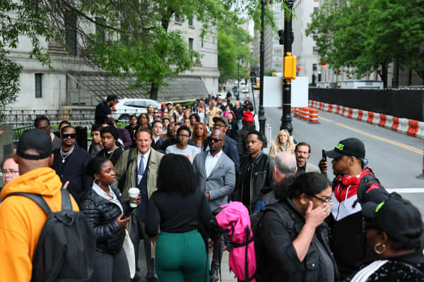 People wait to enter Manhattan Federal Court for the trial of Sean "Diddy" Combs on May 13, 2025 in New York City.