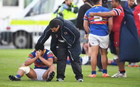 Dejected St Thomas' player Patrick Elia is consoled after losing by golden point.
Kelston Boys High School v St Thomas of Canterbury.â¨NZRL National Secondary Schools Rugby League Championships, Bruce Pulman Park, Auckland. 7 September 2017. Â© Copyright Photo : Andrew Cornaga / www.photosport.nz