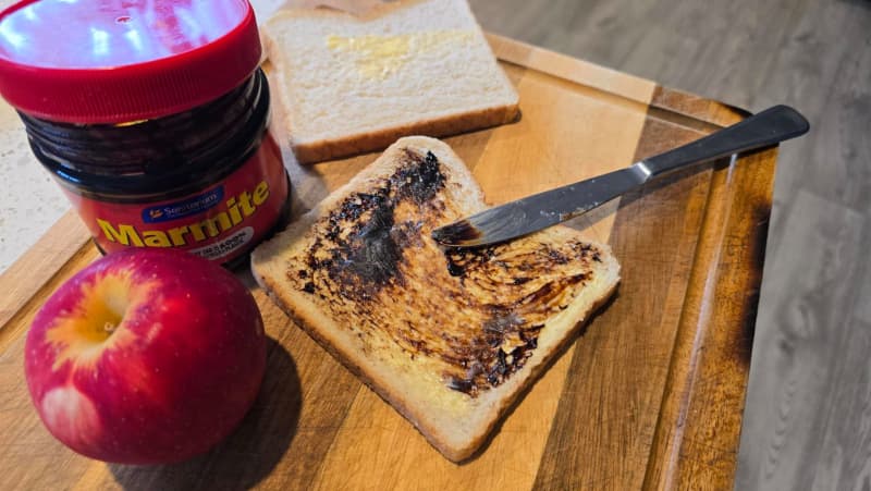 A Marmite sandwich being made.