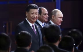 From left, Chinese President Xi Jinping, Egypt's President Abdel-Fattah El-Sisi and Russian President Vladimir Putin arrive for the opening ceremony of the second Belt and Road Forum for International Cooperation (BRF) in Beijing,