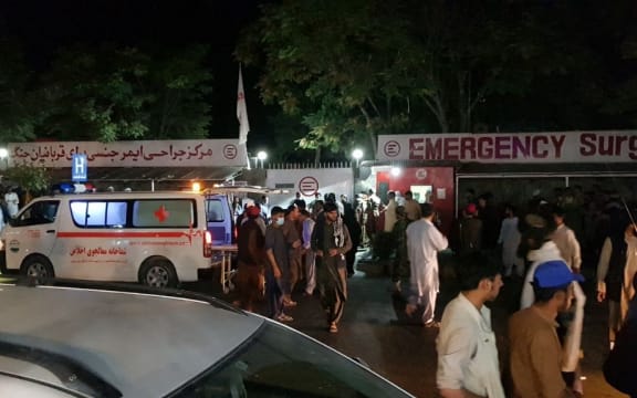 KABUL, AFGHANISTAN - AUGUST 26: Injured people being carried to a hospital as unspecified number of casualties reported after two explosions outside Hamid Karzai International Airport in Kabul, Afghanistan on August 26, 2021.