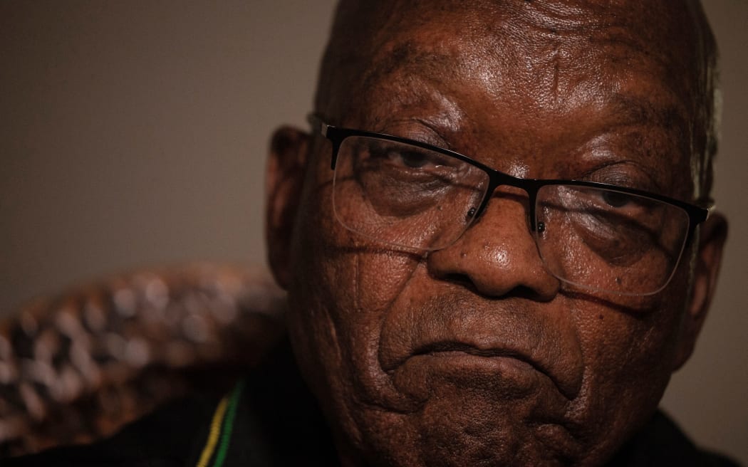 In this file photo taken on July 04, 2021 Former South African president Jacob Zuma addresses the media in his home in Nkandla, KwaZulu-Natal.