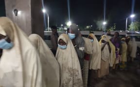 A group of girls previously kidnapped from their boarding school in northern Nigeria arrive on March 2, 2021 at the Government House in Gusau, Zamfara State upon their release.