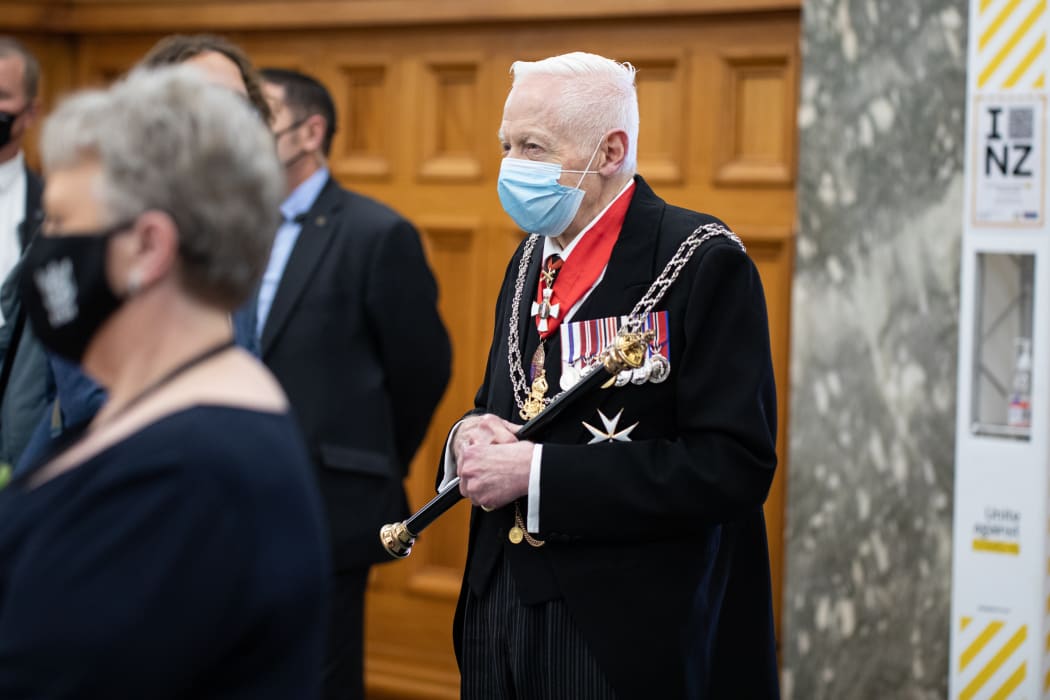 The Queen's other representative Phillip O'Shea watches on. He is the Herald of arms and part of both the Governor General and the Queen's official 'Households'.
