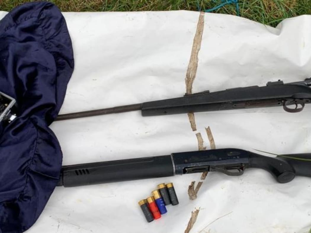 Police display a Carl Gustav .308 rifle, and  Escort Legacy semi-automatic 12-gauge shotgun (bottom).