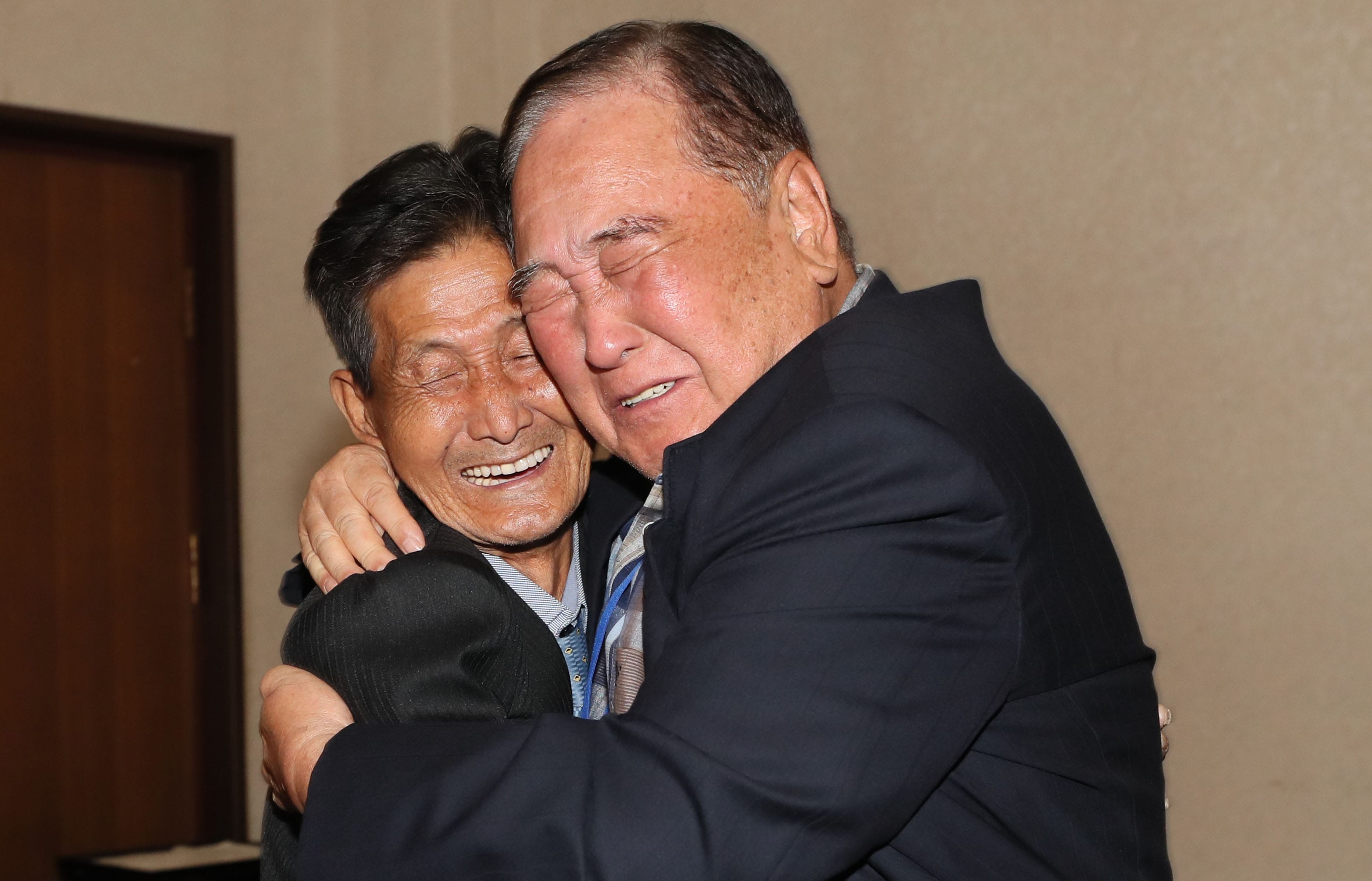 South Korean Ham Sung-chan (R), 93, hugs his North Korean brother Ham Dong Chan (L), 79, during a separated family reunion meeting at the Mount Kumgang resort on the North's southeastern coast on August 20, 2018.