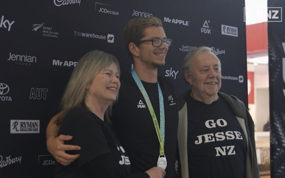 Para-swimmer Jesse Reynolds with his parents Neil and Tracy.