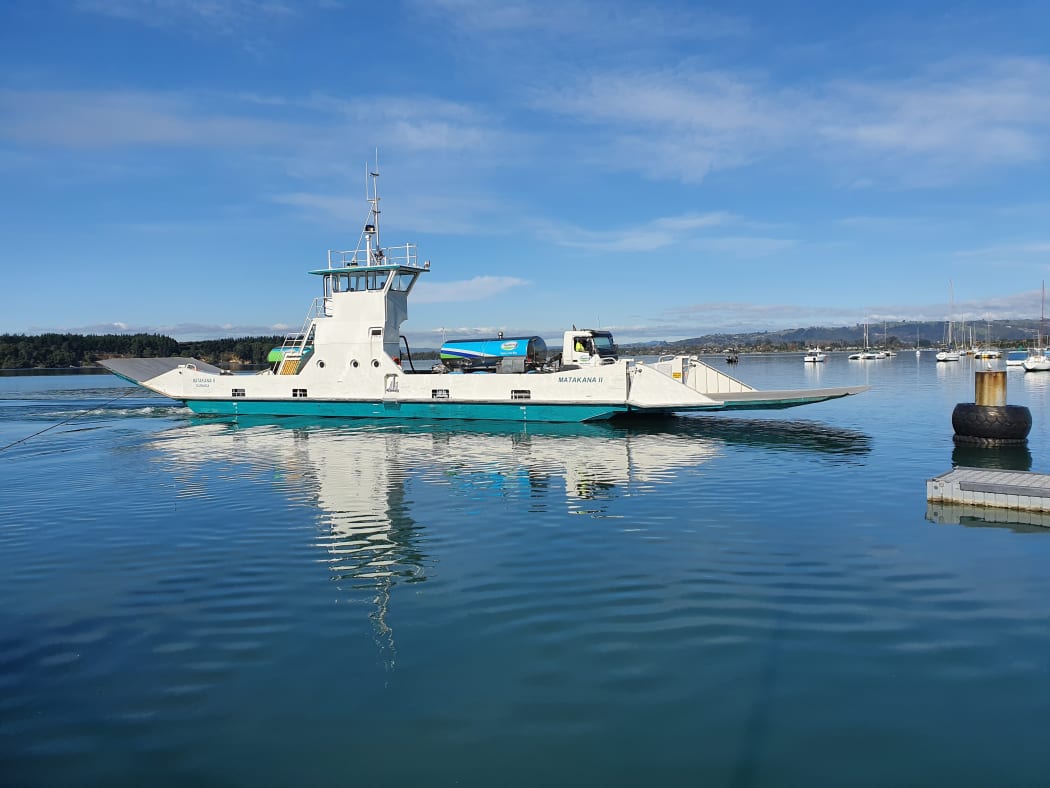 Milk tanker arriving by ferry at Omokoroa from Matakana Island