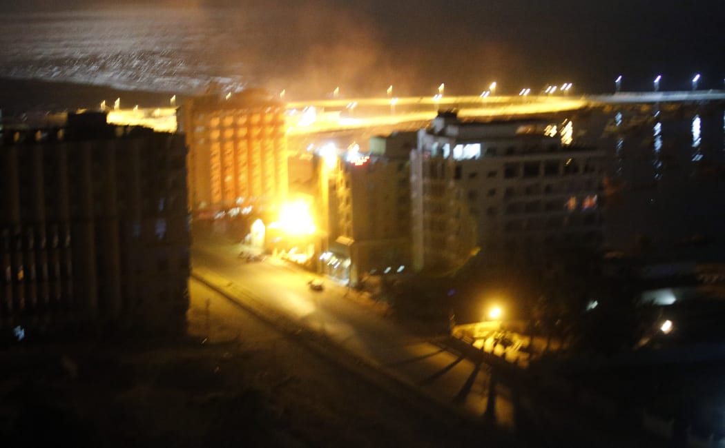 Israeli artillery hits a police building in Gaza City.