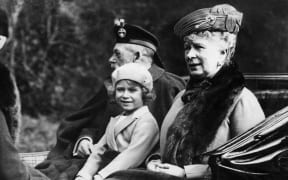 Then Princess Elizabeth sitting in the horse drawn carriage with her grandparents King George V and Queen Mary on the way back to Balmoral after attending church at nearby Crathie on 5 September 1932.