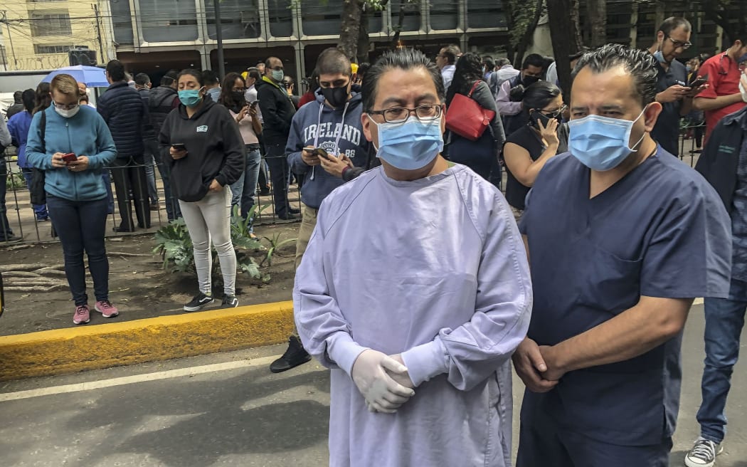 Health workers and others outside a clinic in Mexico City after the quake struck.