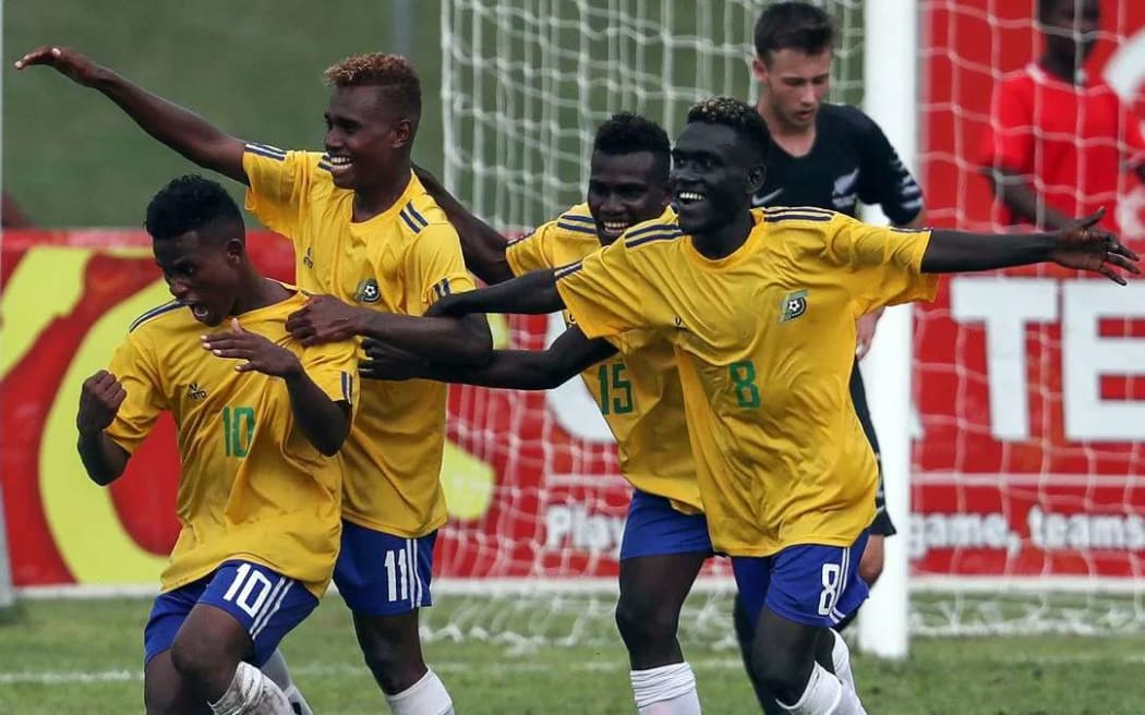 Solomon Islands celebrate victory over New Zealand.