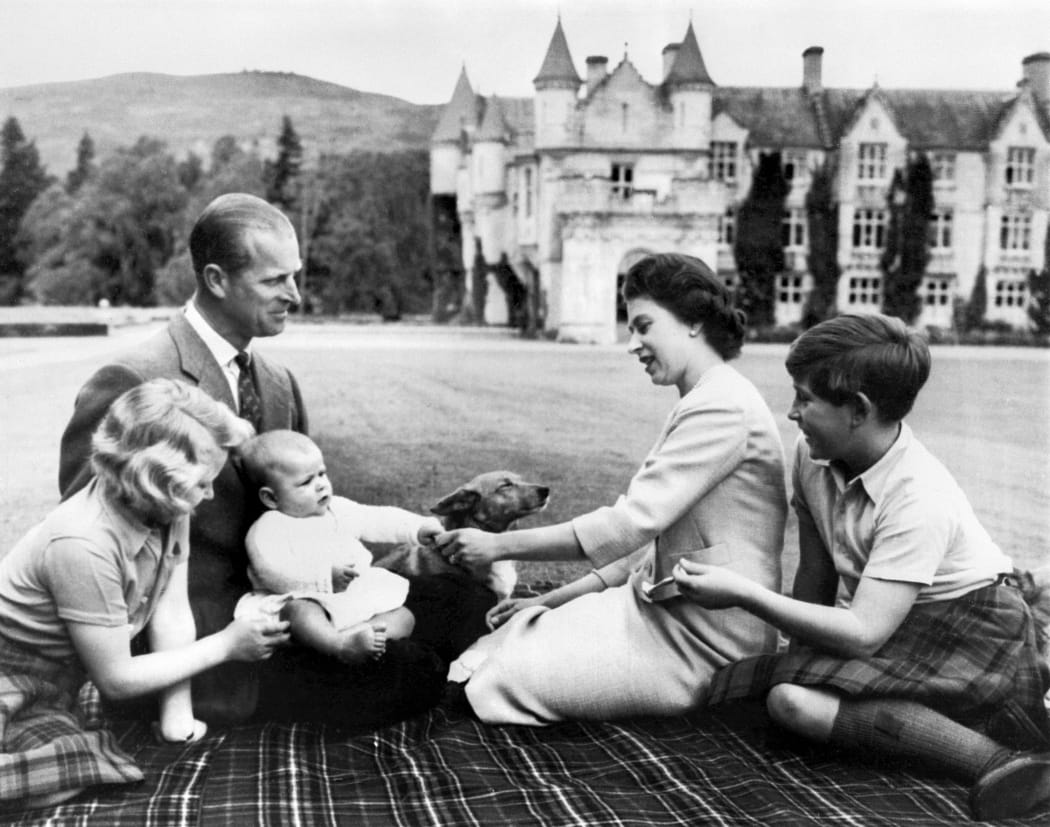A photo taken on 9 September 1960 Britain's Queen Elizabeth II (2R), Britain's Prince Philip, Duke of Edinburgh (2L) and their three children Prince Charles (R), Princess Anne (L) and Prince Andrew (3L) pose in the grounds of Balmoral Castle, near the village of Crathie in Aberdeenshire.