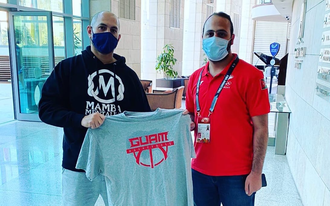 Coach EJ Calvo gives his Guam shirt to a new fan of Guam Basketball from Jordan.