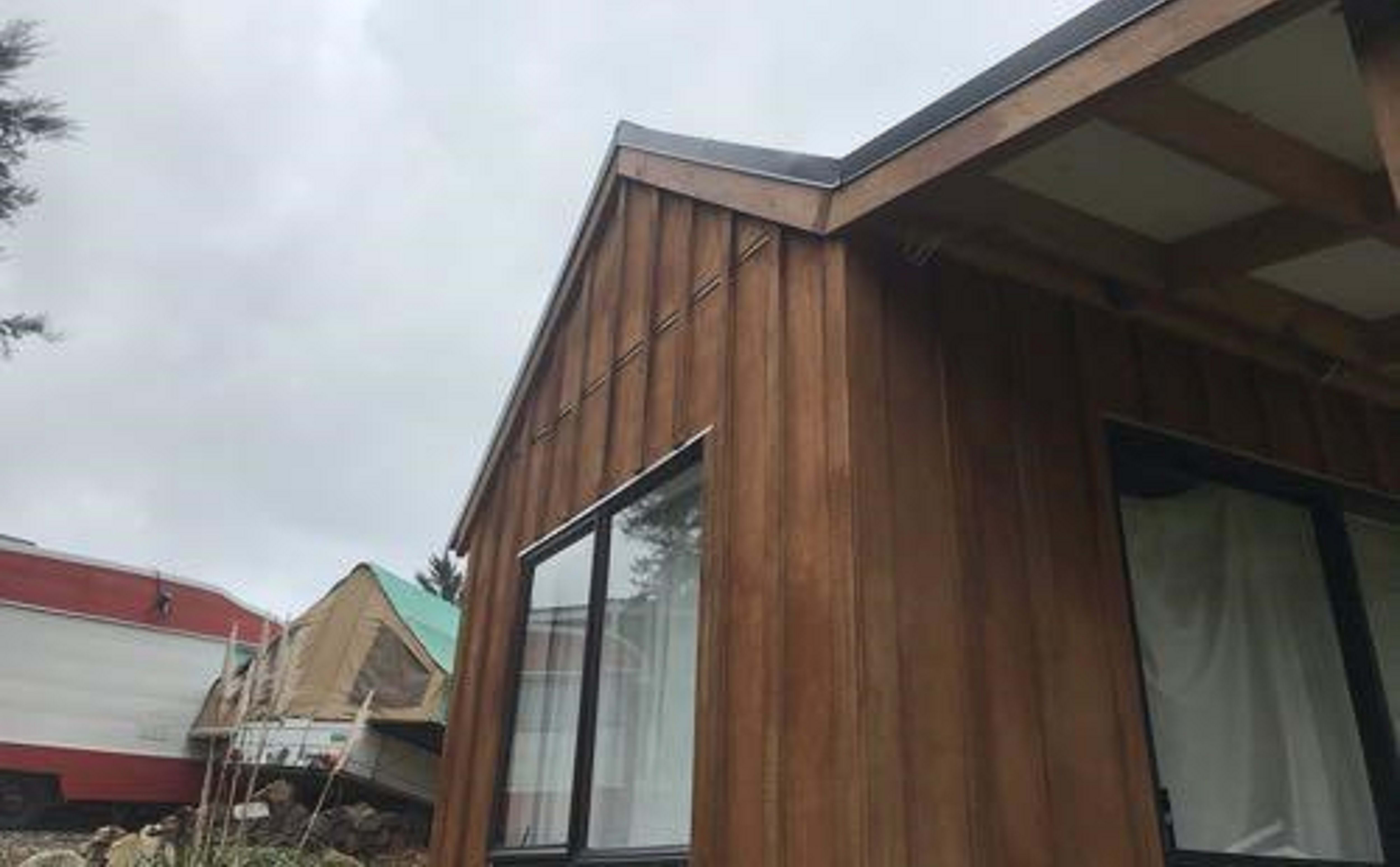 The shed's owners have moved into a caravan behind the building.