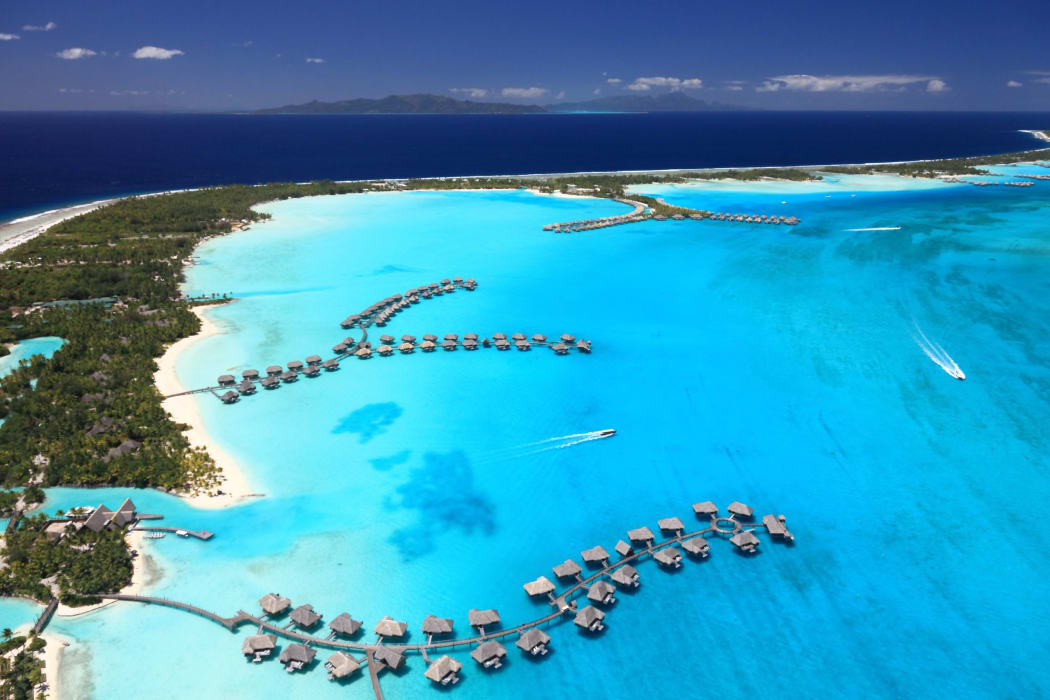 Over water bungalows in Bora Bora Lagoon, French Polynesia.