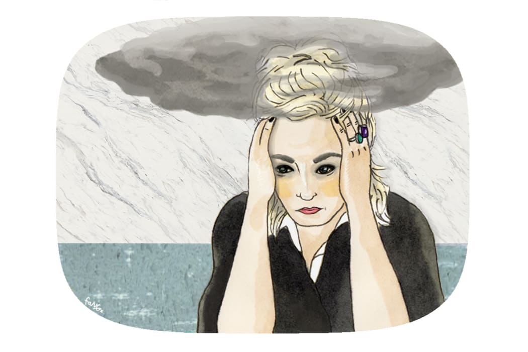 A young woman looking depressed.