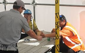 Young prisoner "SB" hands  over chips for morning tea.