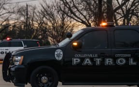 Colleyville law enforcement sit parked near the Congregation Beth Israel synagogue in Colleyville, Texas.