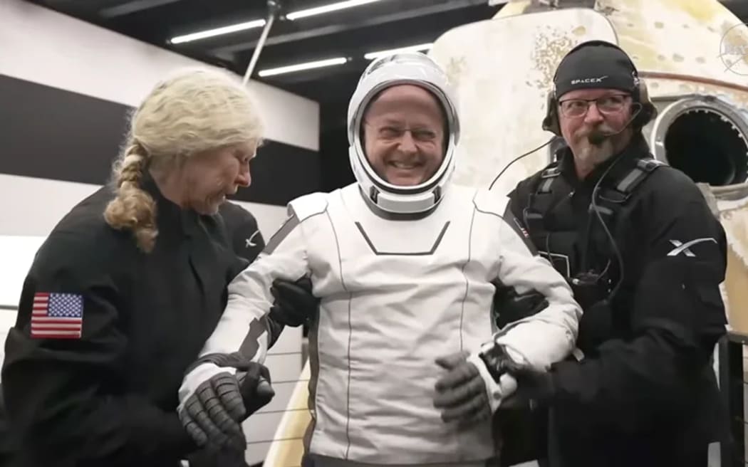 NASA astronaut Mike Fincke was first to emerge from the capsule.