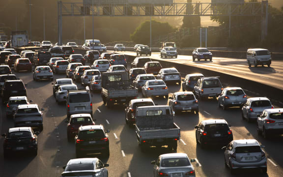 State Highway 16 full of slow moving morning traffic as the sun rises.