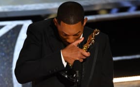 US actor Will Smith accepts the award for Best Actor in a Leading Role for "King Richard" onstage during the 94th Oscars at the Dolby Theatre in Hollywood, California on March 27, 2022.