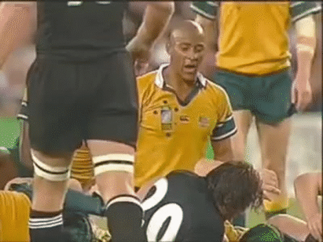 An animated gif of former Australian captain George Gregan taunting the 2003 All Blacks with the comment ""four more years".