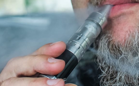 Man vaping while driving a car is seen in Gdansk, Poland on 9 July 2019