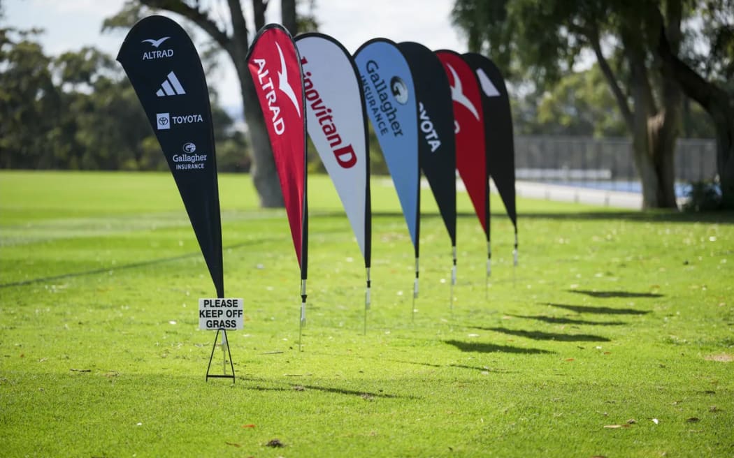 Sponsor signage during an All Blacks training session.