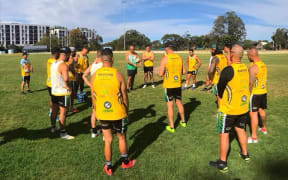 Cook Islands rugby league coach Tony Iro (top centre) issues instructions during training.