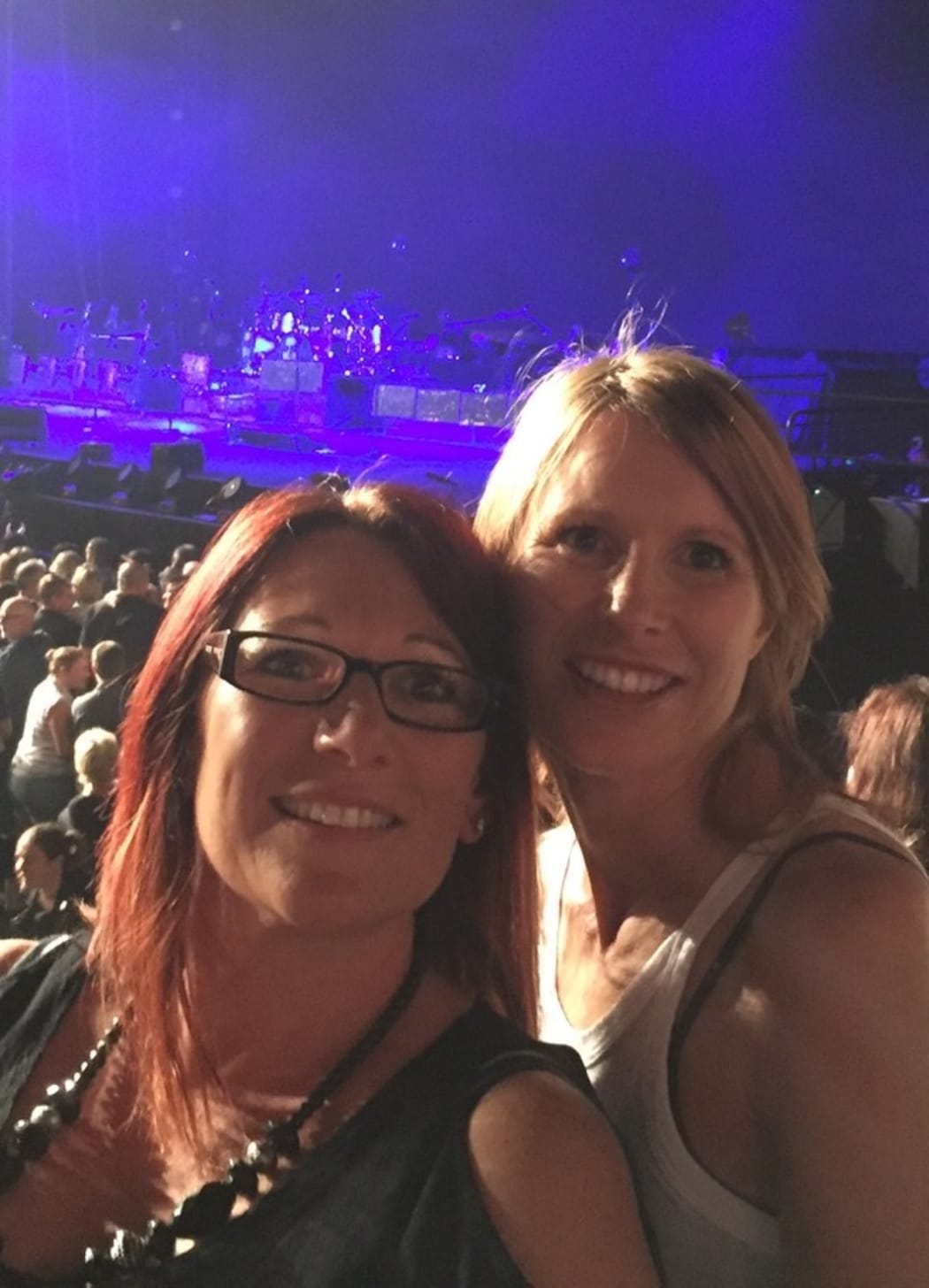 Jo Pert, right, with her cousin at a Robbie Williams concert.
